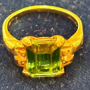 Elegant Gold Ring with Green Gemstone